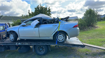 Old car being loaded for eco-friendly car disposal in Hastings